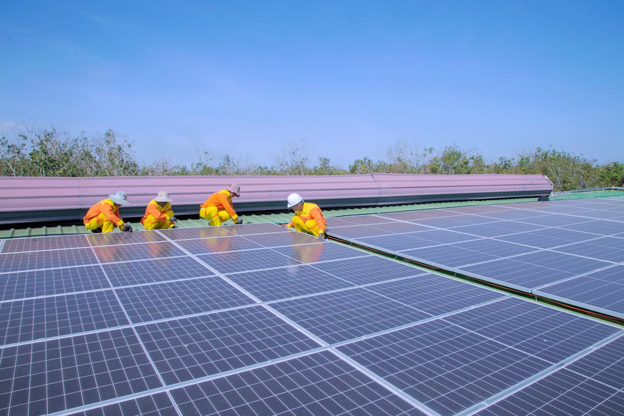 Services Workers installing solar panels on a sunny day, promoting renewable energy and sustainability.