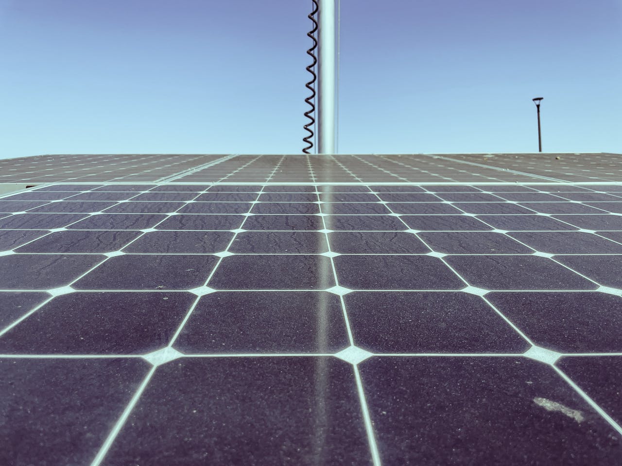 Services Detailed view of solar panels capturing sunlight, showcasing renewable energy technology.